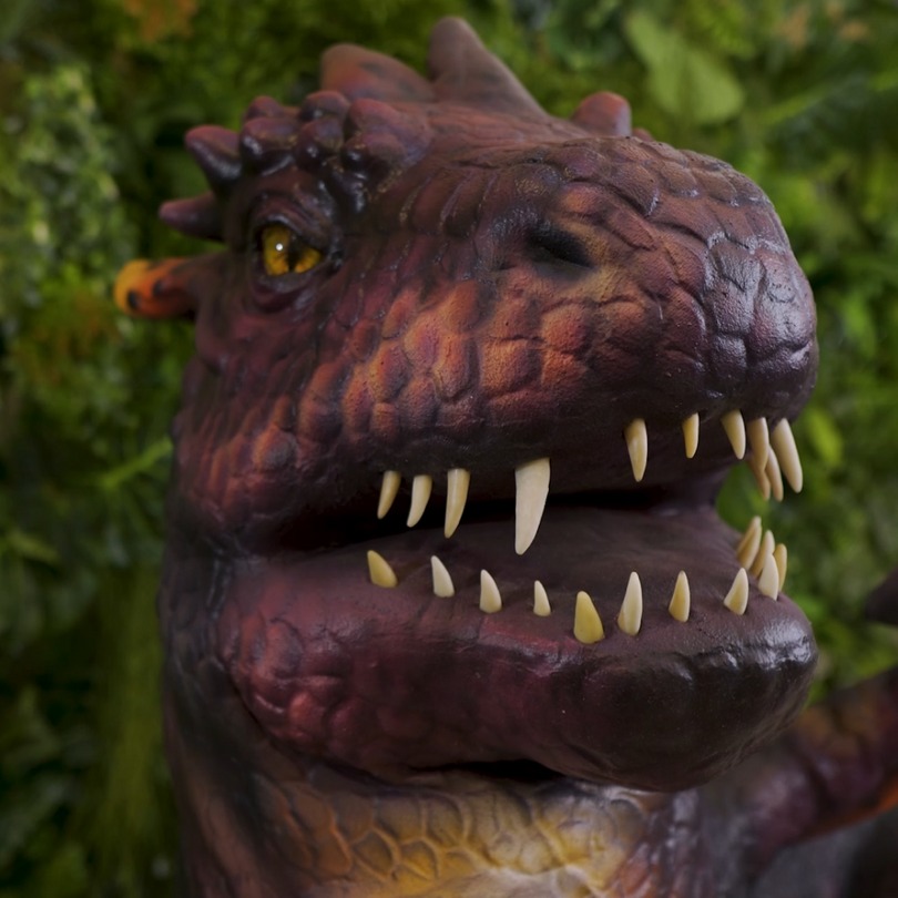 Dragon on a tree - photo of an animatronic figure in stock